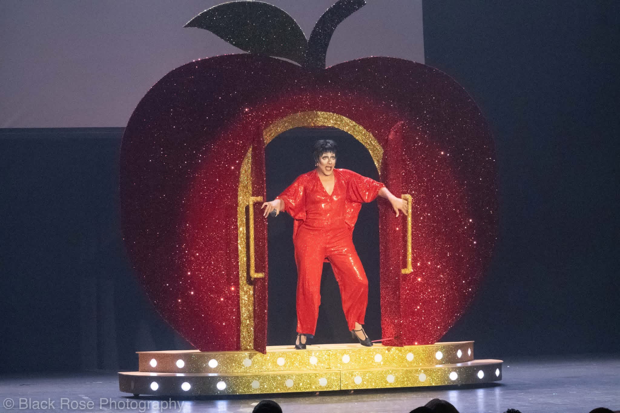 Person inside finished apple showing scale