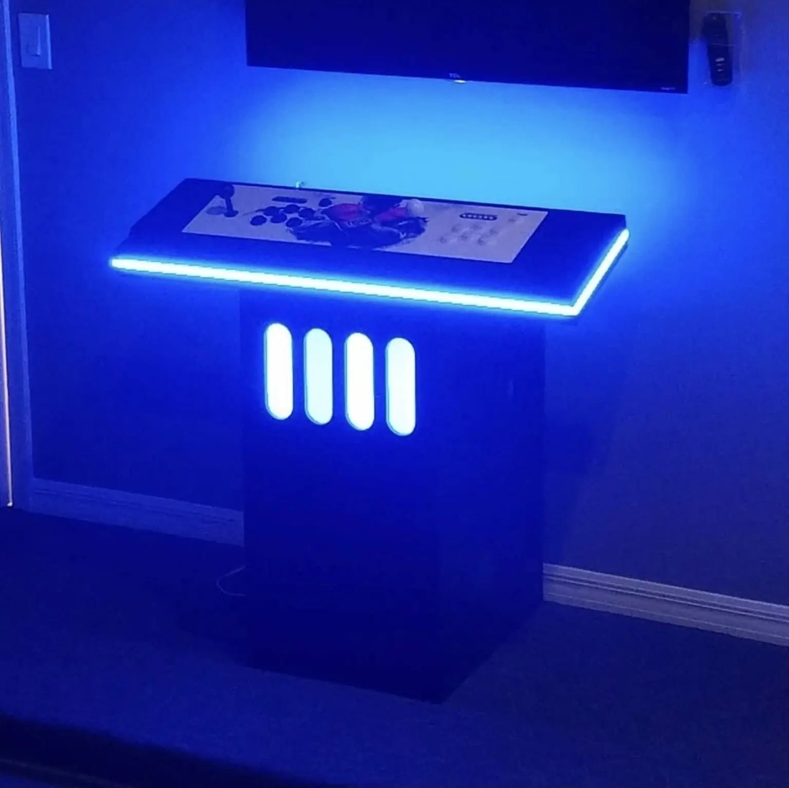 Blue illuminated gaming table installation